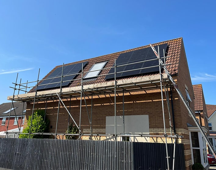 solar panels on roof with scaffolding